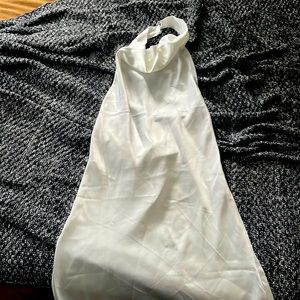 New mini white halter dress. Pearl like button details. Didn’t fit me.